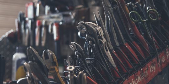 selective focus photography of mechanics tool lot